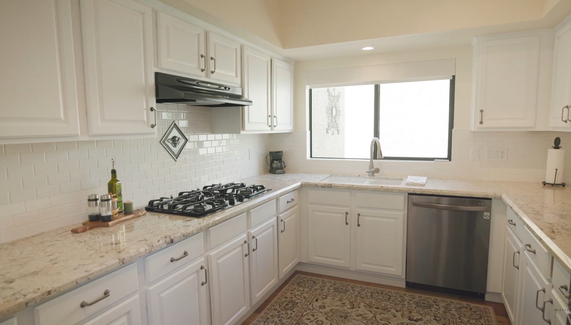 Mercer Lane kitchen before renovation — white cabinetry